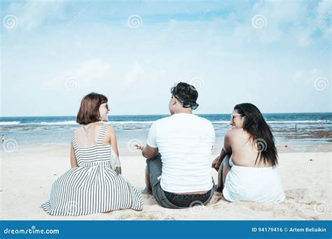 Group Of Multiracial Friends Sitting On The Beach Of Tropical Bali