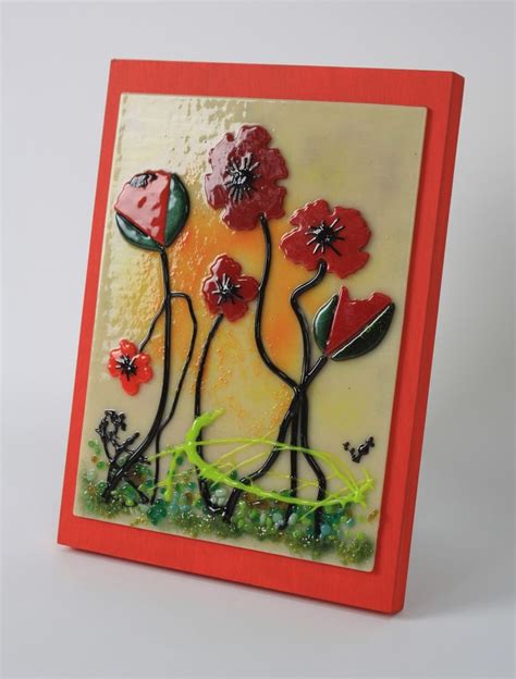 Fused Glass Poppies Set In A Green Field Against A Sunset Background