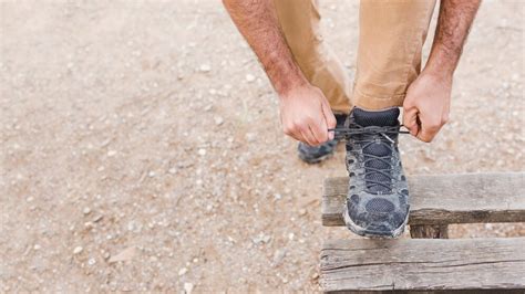 Free Photo Crop Man Tying Laces