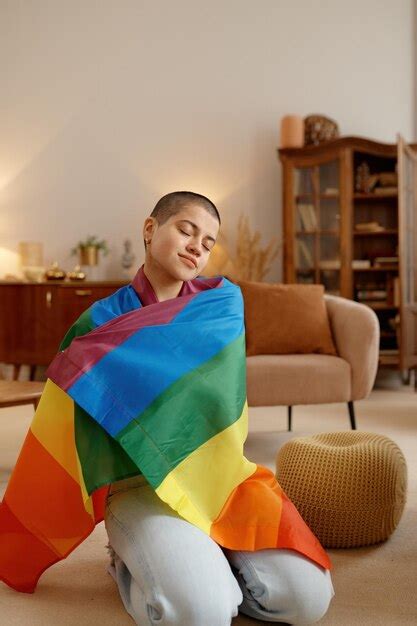 Premium Photo Young Lgbt Woman Wrapped In Rainbow Flag Feeling Proud