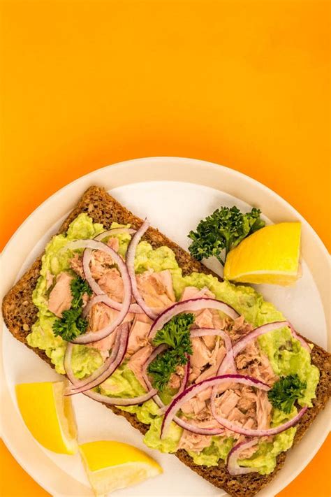 Tuna Fish And Avocado With Onions On Rye Bread Open Face Sandwich Stock