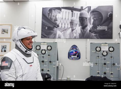 Nasa Astronaut Robert Behnken Smiles As He Suits Up In His Spacex