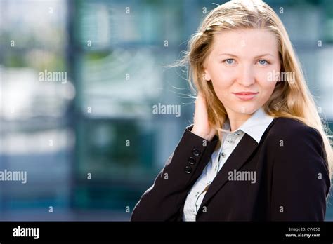 Beautiful Blonde Girl As Business Woman In Front Of Office Building Stock Photo Alamy