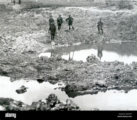 First World War British Officers And Soldiers Inspect A Shell Ravaged