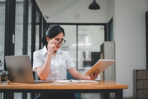 Attractive Mature Businesswoman Working On Laptop Stock Photo Image