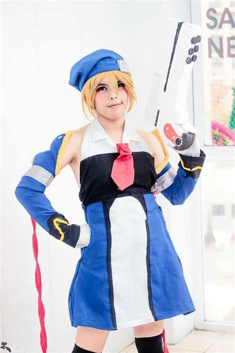 A Woman Dressed In An Anime Cosplay Holding A Pair Of Scissor