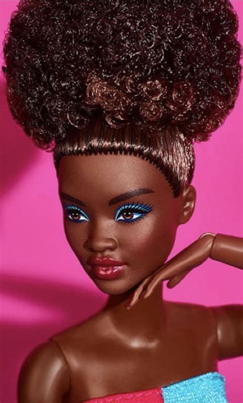 A Barbie Doll With An Afro And Blue Eyes