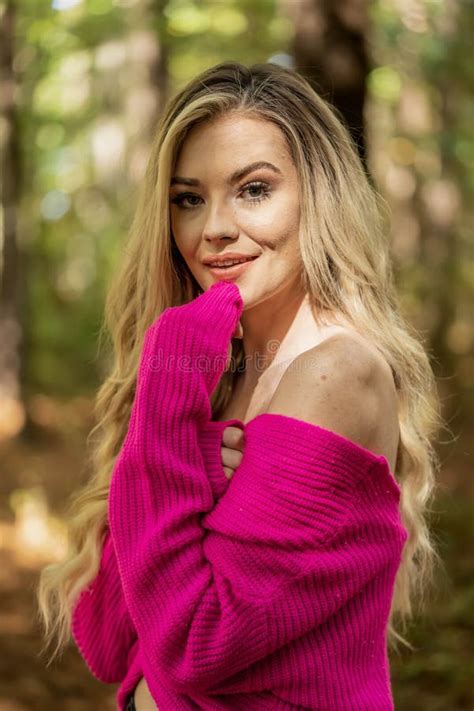 A Lovely Blonde Model In Western Gear Poses Outdoor While Enjoying The Spring Weather Stock