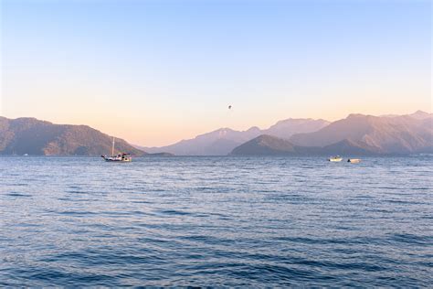 Three Boat On Body Of Water Near Land · Free Stock Photo