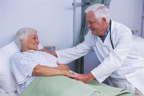 Premium Photo Doctor Consoling Senior Patient