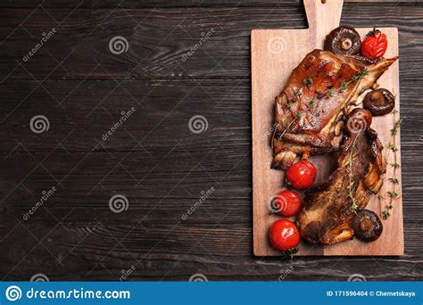 Delicious Roasted Ribs Served On Black Table Top View Space For Text