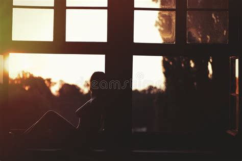 Beautiful Naked Female Sitting On A Window At Sunset Stock Image Image Of Dark Sunset