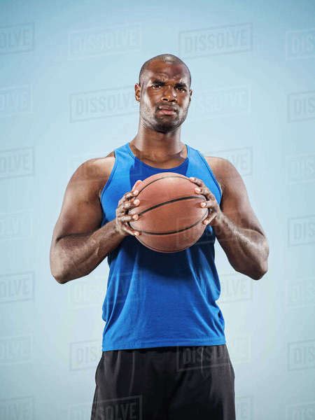 Portrait Of Serious Black Man Holding Basketball Stock Photo Dissolve