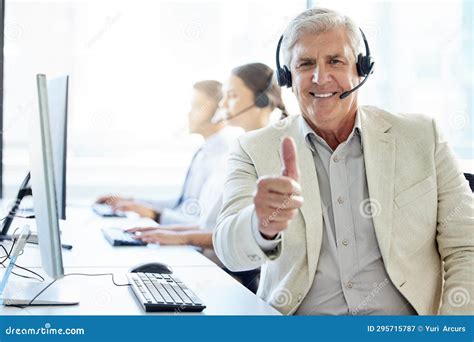 Making Sure The Customer Is Always Happy A Mature Man Showing Thumbs
