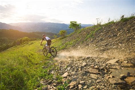 Cyclist Man Riding On Rough Road In The Mountain Del Colaborador De