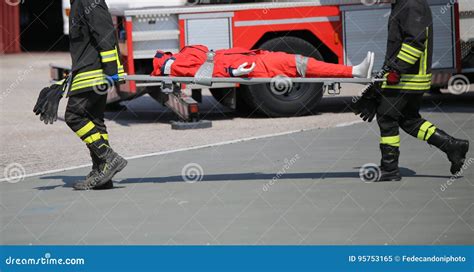 Firefighters During The Exercise To Carry The Injured With The S Stock