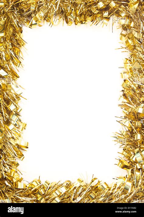 Gold Christmas tinsel garland, forming a rectangular border on white ...