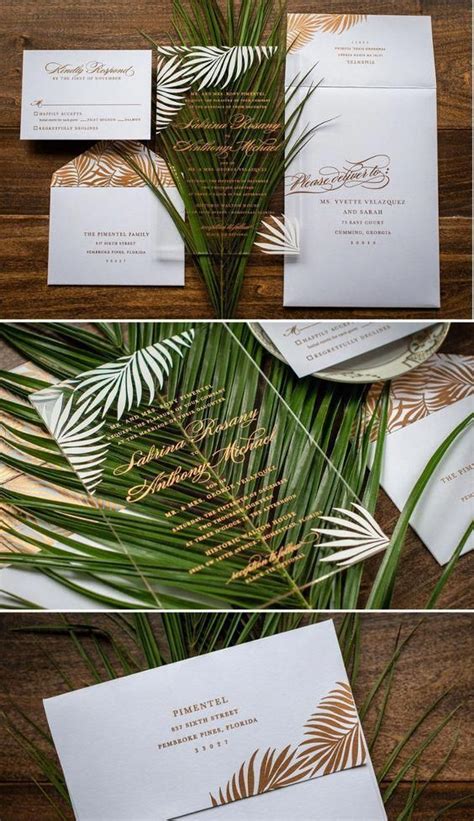 The Wedding Stationery Is Laid Out On Top Of Each Other With Palm Leaves