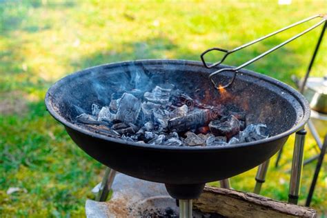 Hot Empty Portable Barbecue BBQ Grill With Flaming Fire And Ember Charcoal Stock Photo Image