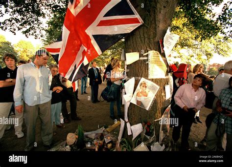 Flowers And Mourners Outside Kensington Palace In The Days Following