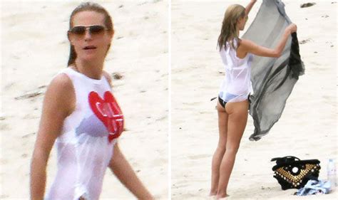 Heidi Klum Displays Her Pert Derriere In A Wet T Shirt During Beach Day