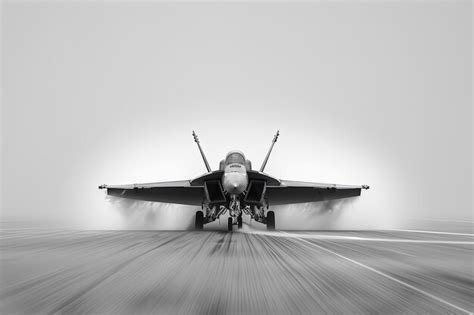 Premium Photo | A fighter jet taking off from an airport runway