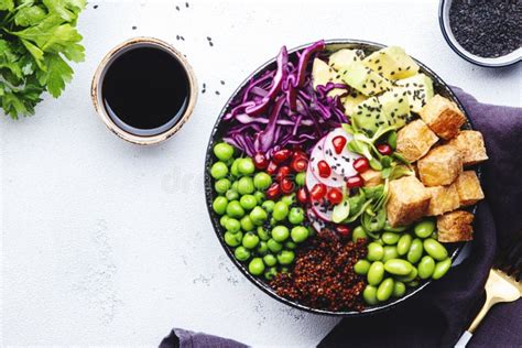 Healthy Vegan Diet Food Buddha Bowl With Quinoa Fried Tofu Avocado Edamame Beans Peas