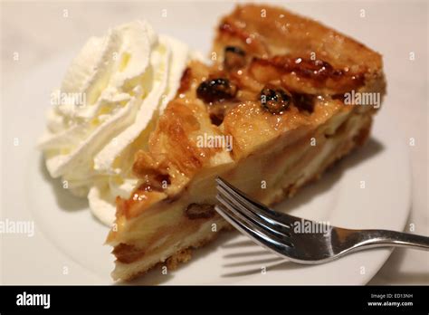 Dutch apple pie (Appeltaart) served with whipped cream in The Hague (Den Haag), the Netherlands ...