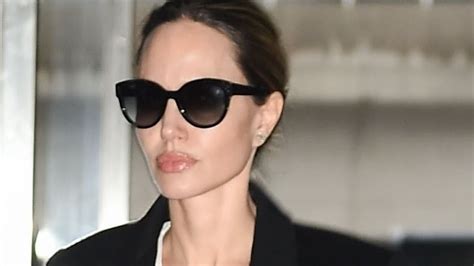 Angelina Jolie Looks Chic In Maxi Dress And Coat As She Arrives To Jfk