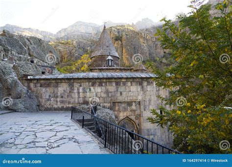 Beautiful Scenery Of The Monastery Geghard With High Rocky Mountains In