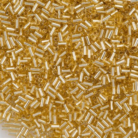 25g Toho 3mm Bugle Bead Transparent Silver Lined Gold 22 Aura