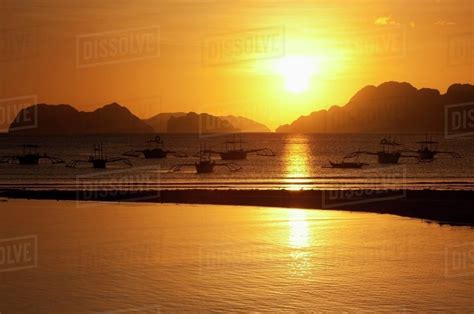 Sunset View Of Islands And Boats From The Beaches Of Corong Corong Near