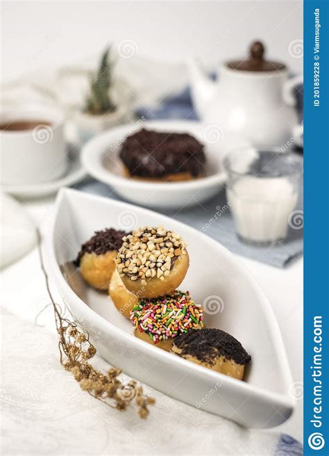 Mini Donuts and Sprinkles Stacked Portrait Stock Photo - Image of food ...