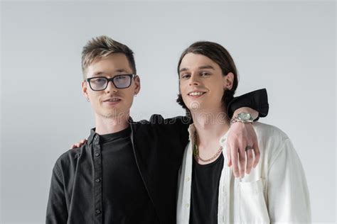 Positive Gay Couple Hugging And Looking Stock Photo Image Of Grey