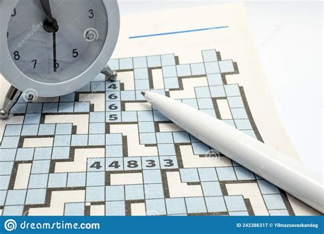 Puzzle And Pencil For Leisure And Entertainment With Clock Stock Image