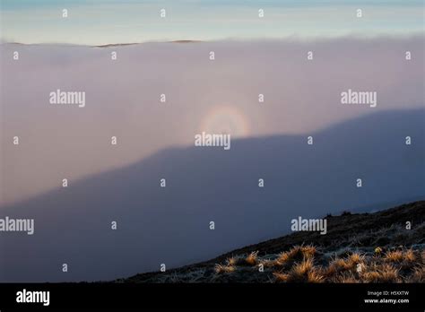 The rare mountain phenomenon of a Brocken Spectre, appears below Heron Pike on the Fairfield ...