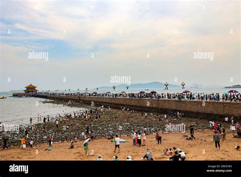 Aerial Photo Shows Tourists Playing In Zhanqiao Pier Scenice Area In