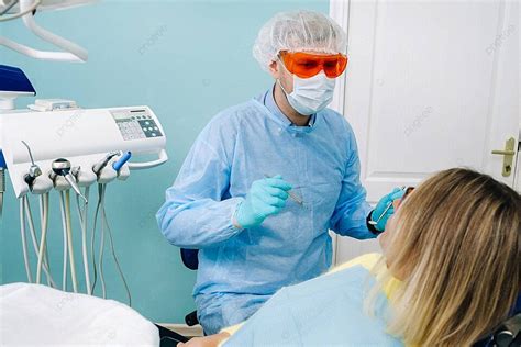 Dental Filling Procedure Patient Receiving Treatment For Teeth At The Dentists Office Photo ...