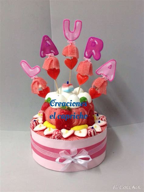 A Birthday Cake With Candles And Hearts On It That Spell Out The Word U