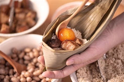 Premium Photo Making Zongzi Food Preparing And Wrapping Chinese Rice