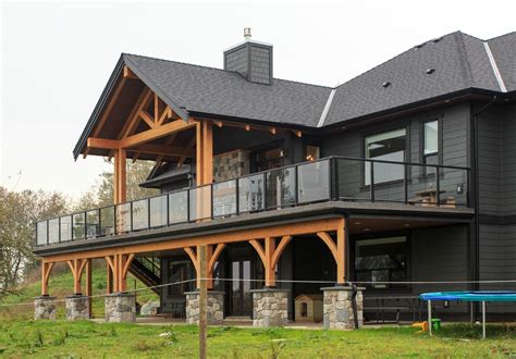 This beautiful 5,100 sq ft. modern designed timber frame log home shows ...