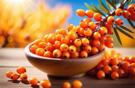 Premium Photo Wooden Plate With Sea Buckthorn On A Wooden Table Ripe