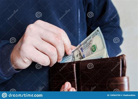 Hands Taking Out Money From Wallet Concept Of Savings Salary Payment