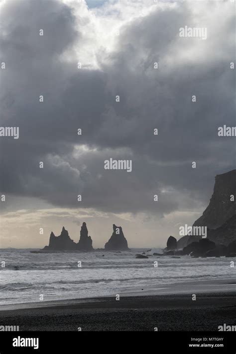 Reynisfjara Black Sand Beach And Reynisdrangar Basalt Sea Stacks As