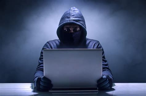 Premium Photo Hacker Using Laptop Hacking The Internet