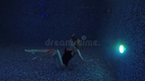 Beautiful Girl Swim Underwater Into Night Waterpool With Lights Stock Footage Video Of