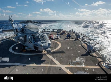 U S Sailors Aboard The Guided Missile Destroyer Uss Arleigh Burke Ddg 51 Refuel An Mh 60s