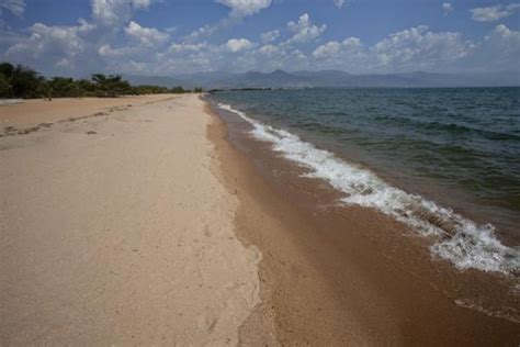 Looking East Along The Sandy Beach Of Saga With The Mountains Of