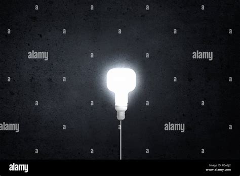 Glowing Inverted Light Bulb On Dark Background Stock Photo Alamy