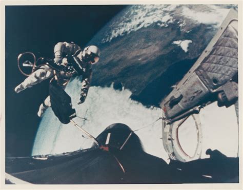 First US Spacewalk: views of Ed White returning to the spacecraft at ...